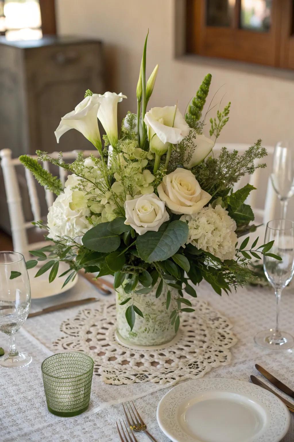 A timeless centerpiece that showcases ivory blossoms alongside abundant verdure.