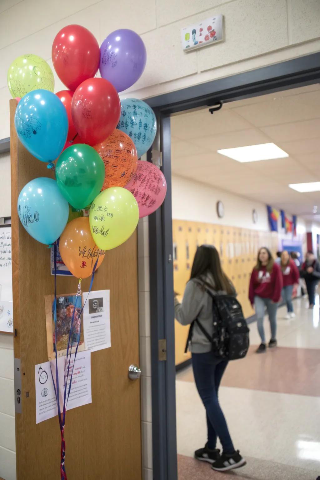 An interactive classroom door featuring balloons for pupils to inscribe kind-hearted messages.