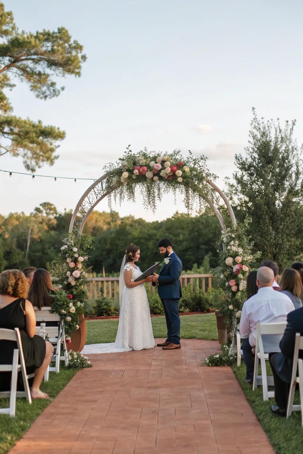An outdoor wedding ceremony showcasing a beautifully decorated archway.