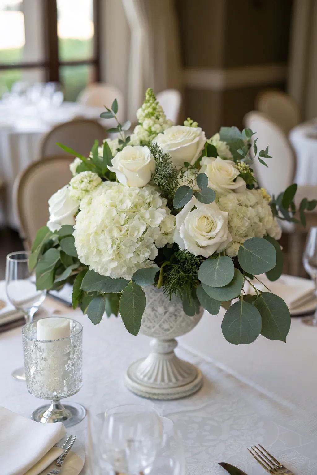 A white floral piece radiates enduring winter elegance.