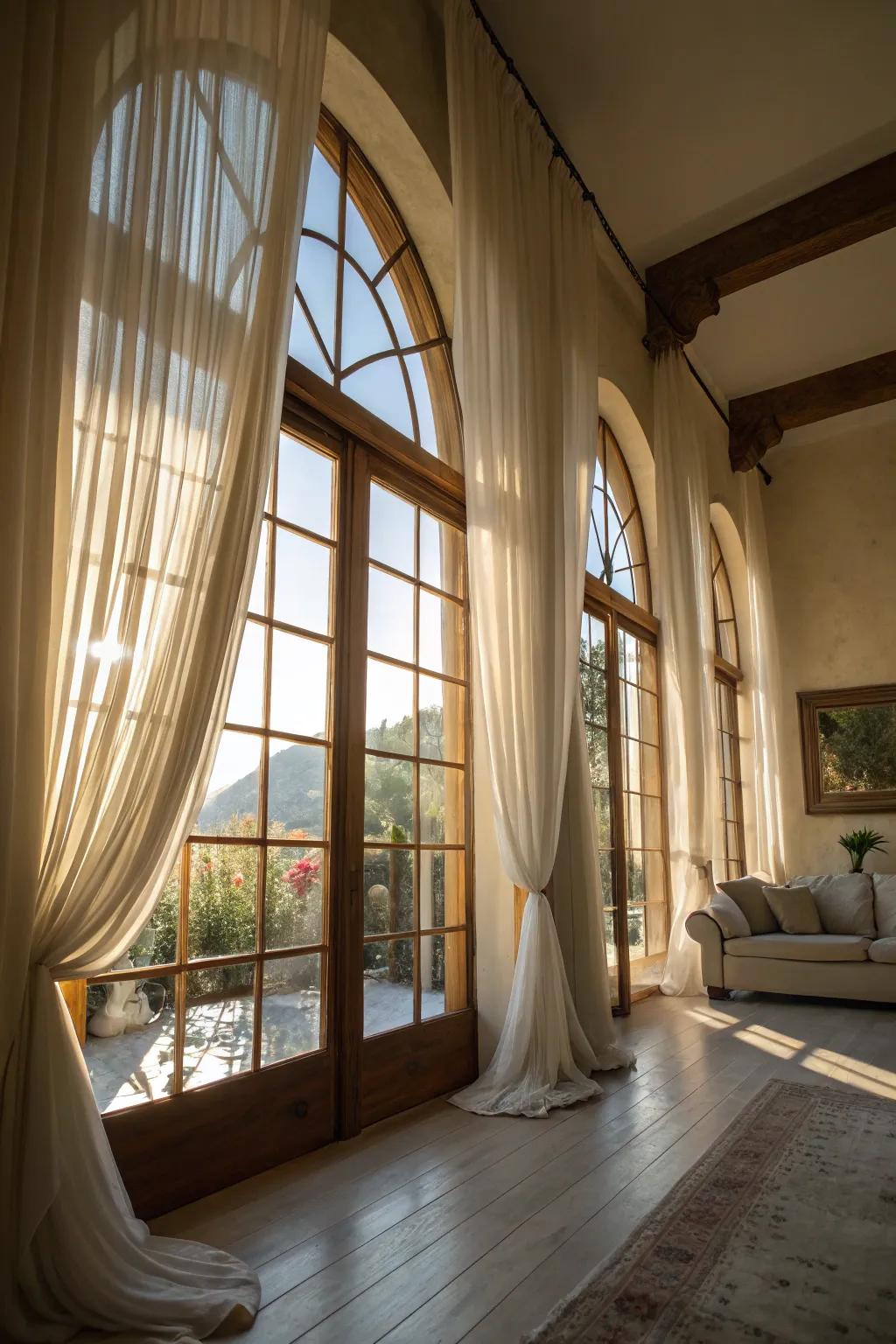Bright room showcasing airy sheer designs on arched windows.