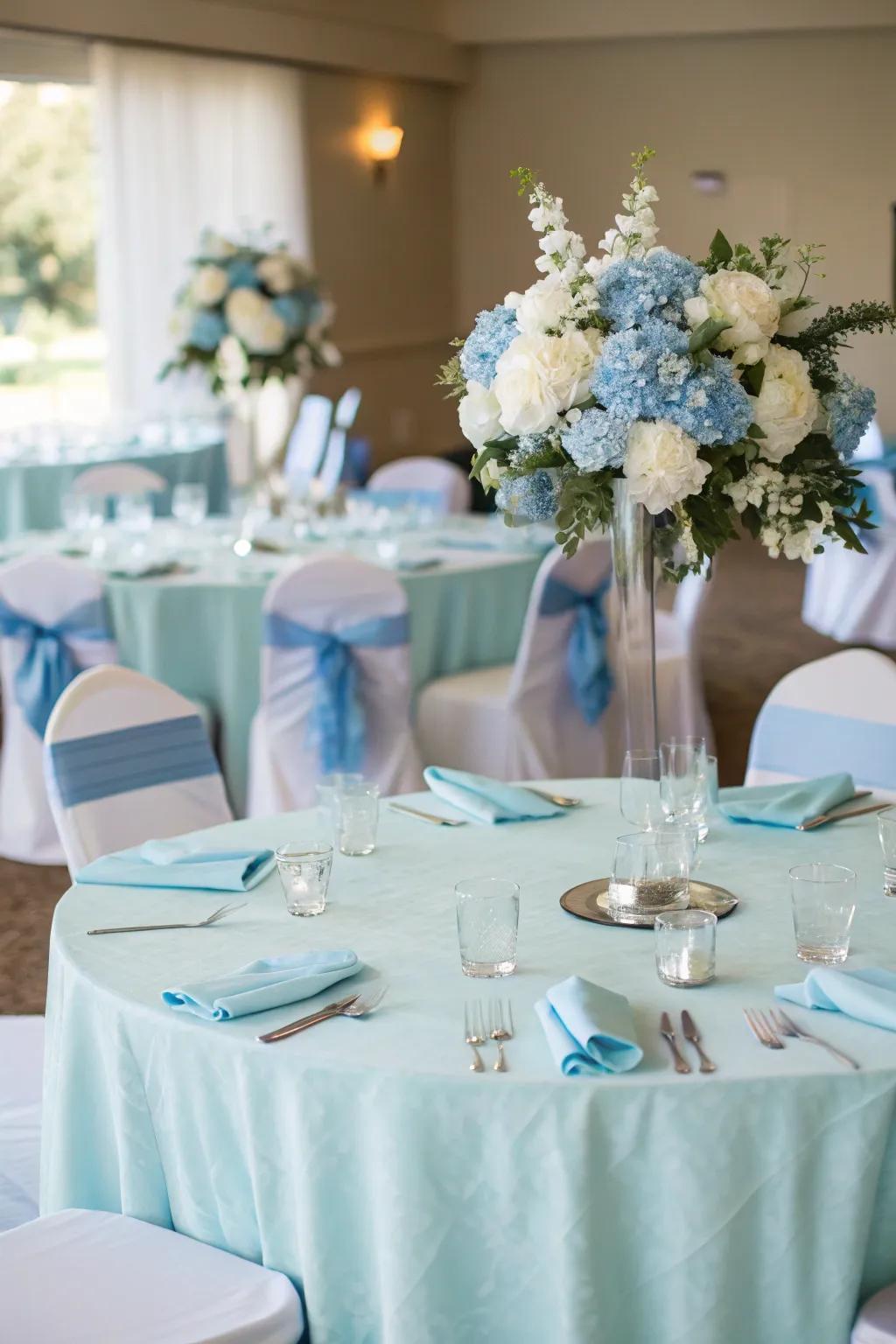 Soft blue reception ornamentation cultivates a harmonious and sophisticated theme.