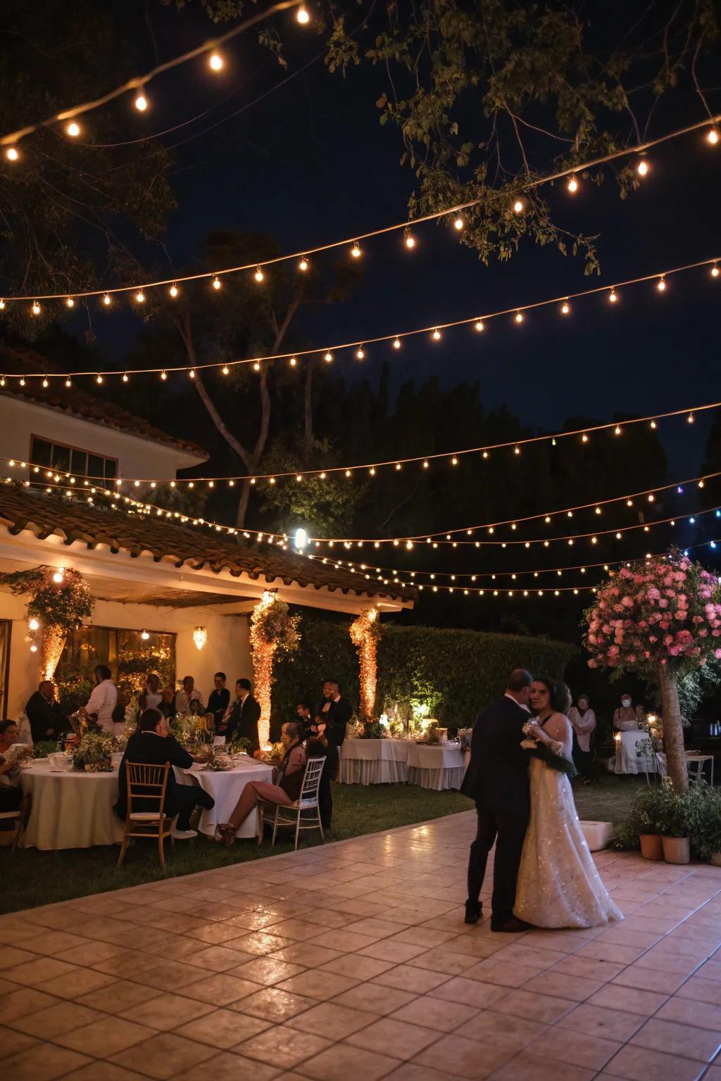 An evening wedding celebration illuminated by the gentle radiance of festoon lights.