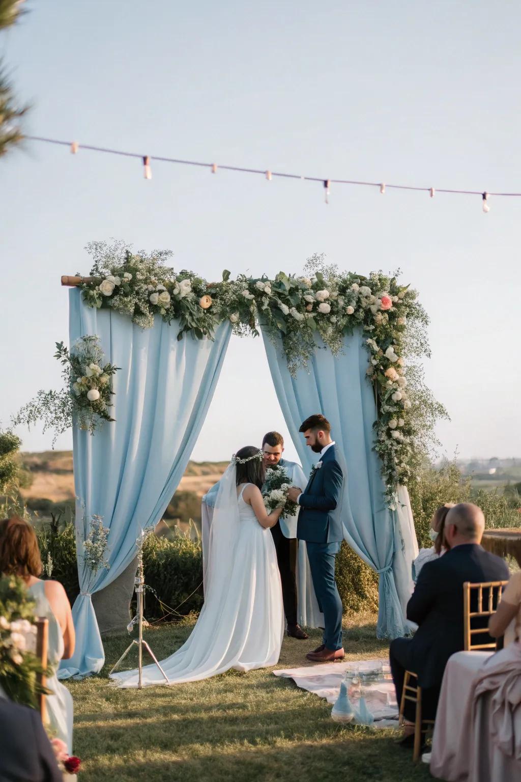 A dreamy ceremony space exhibiting a hazy azure backdrop that amplifies the romantic atmosphere.