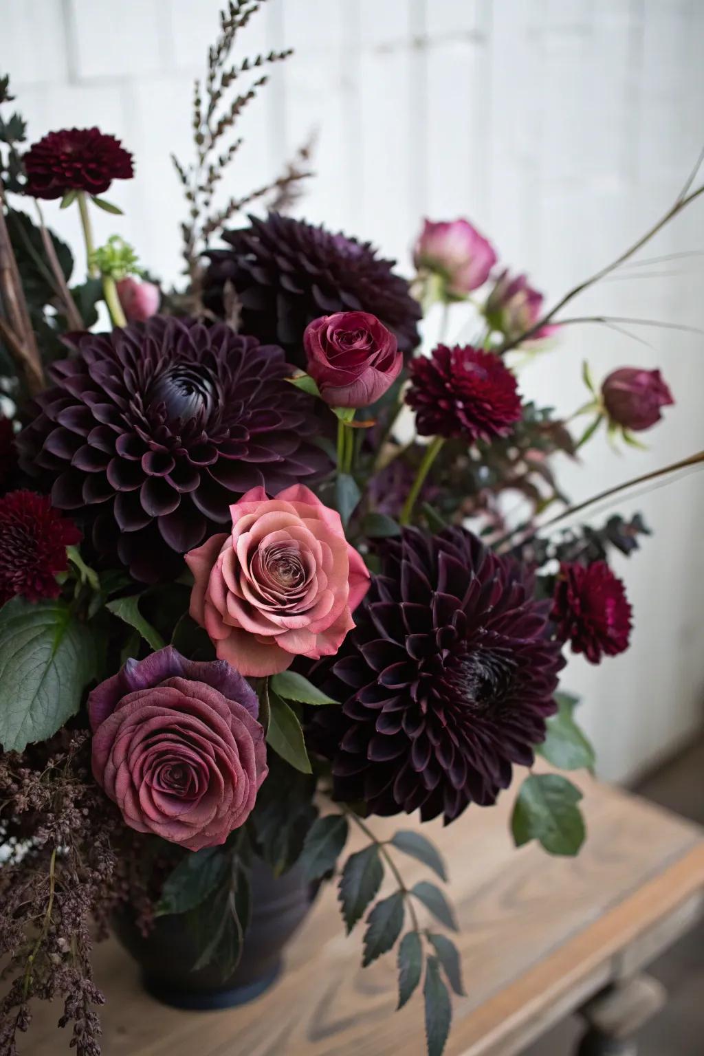 A melancholy bouquet featuring shadowy buds and plum-colored roses.