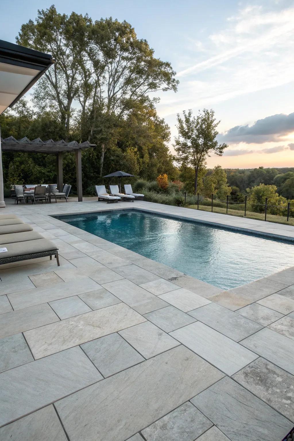 Embrace both strength and elegance through a stone and tile pool deck.