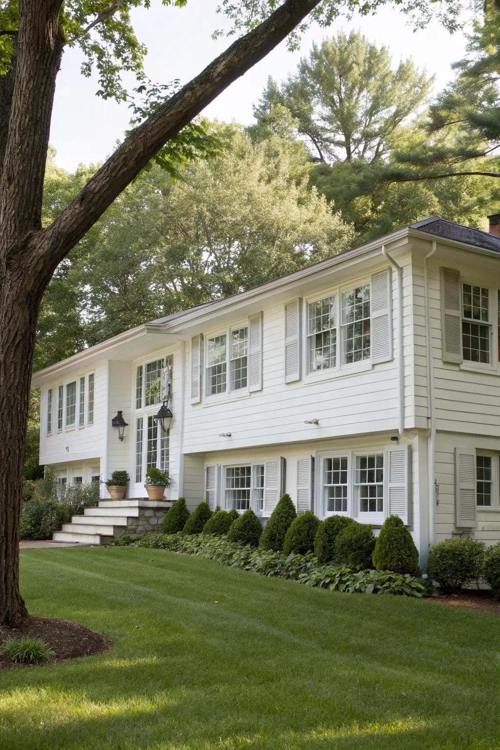 Charming windows featuring timeless bright white window dressings on a raised ranch abode.