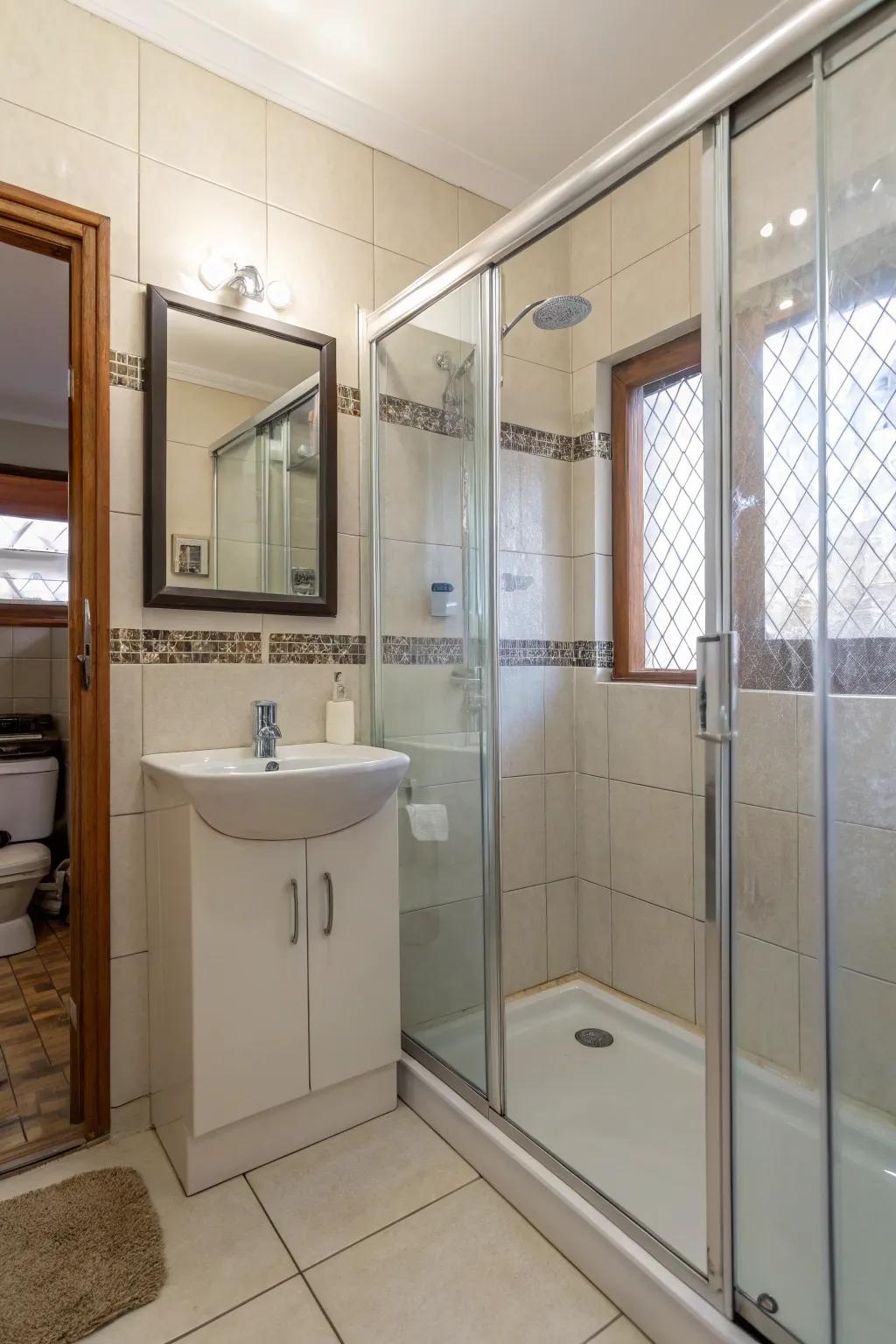 Glass shower entrances establish a seamless, expansive sensation.