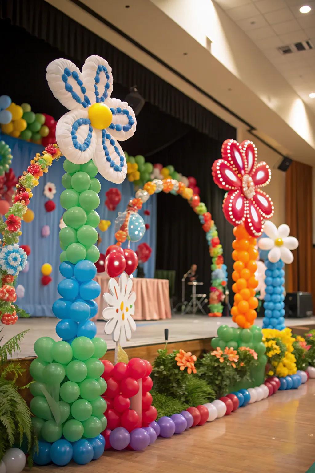 A stage lavishly decorated with fanciful balloon flower structures.