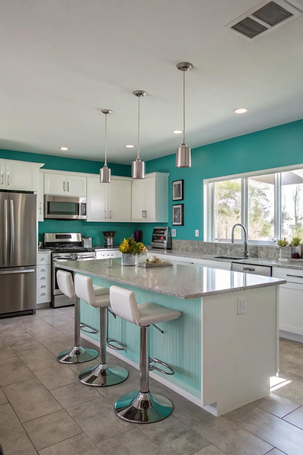 A modern cooking area featuring teal walls and silver details.