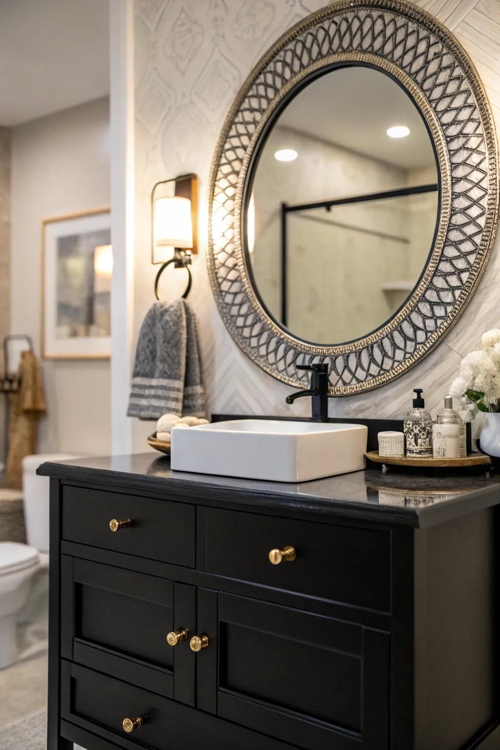 A statement mirror atop a dark-toned vanity can transform the bathroom into an artistic space.