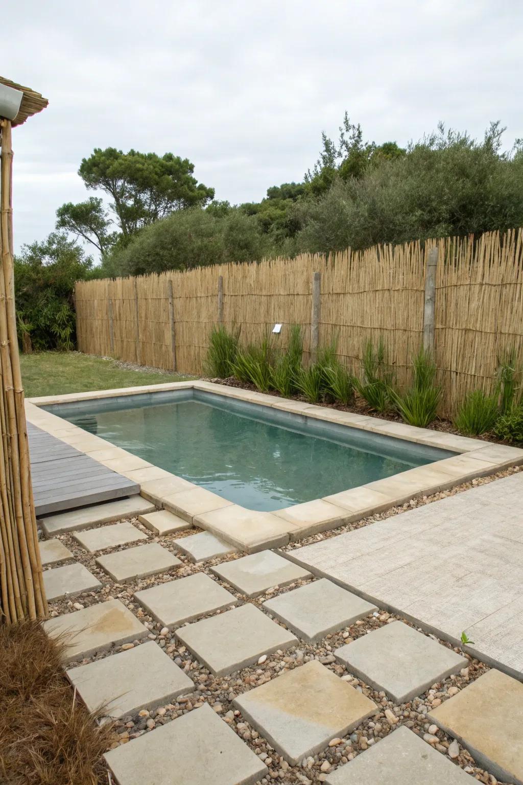 A thatch fence crafting a tranquil, coastal-like atmosphere by the pool.