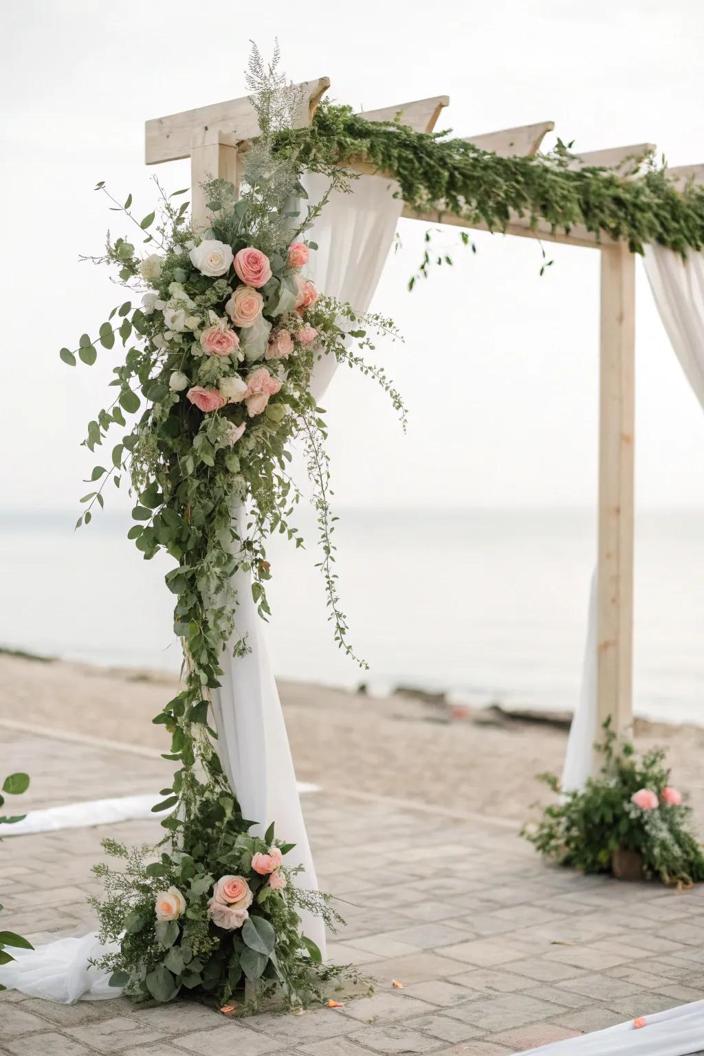 A simple arch with foliage and blossoms frames the celebration beautifully.