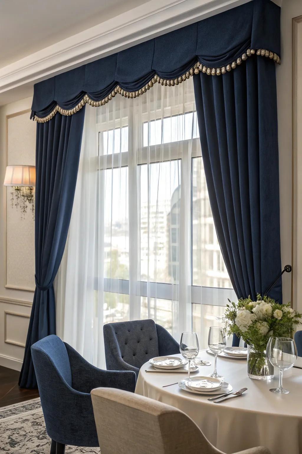 A chic dining room featuring a window with a bold navy valance.