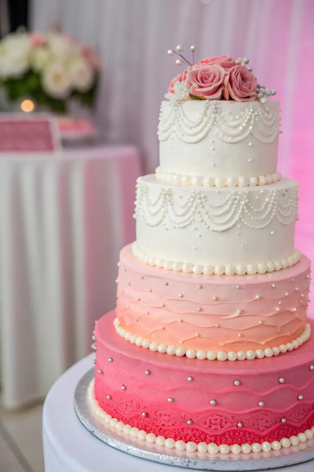 A gradient wedding cake transitioning from white to vibrant pink.
