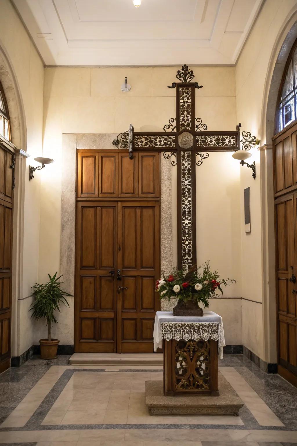 A self-supporting ornamental cross situated within an entrance hall.