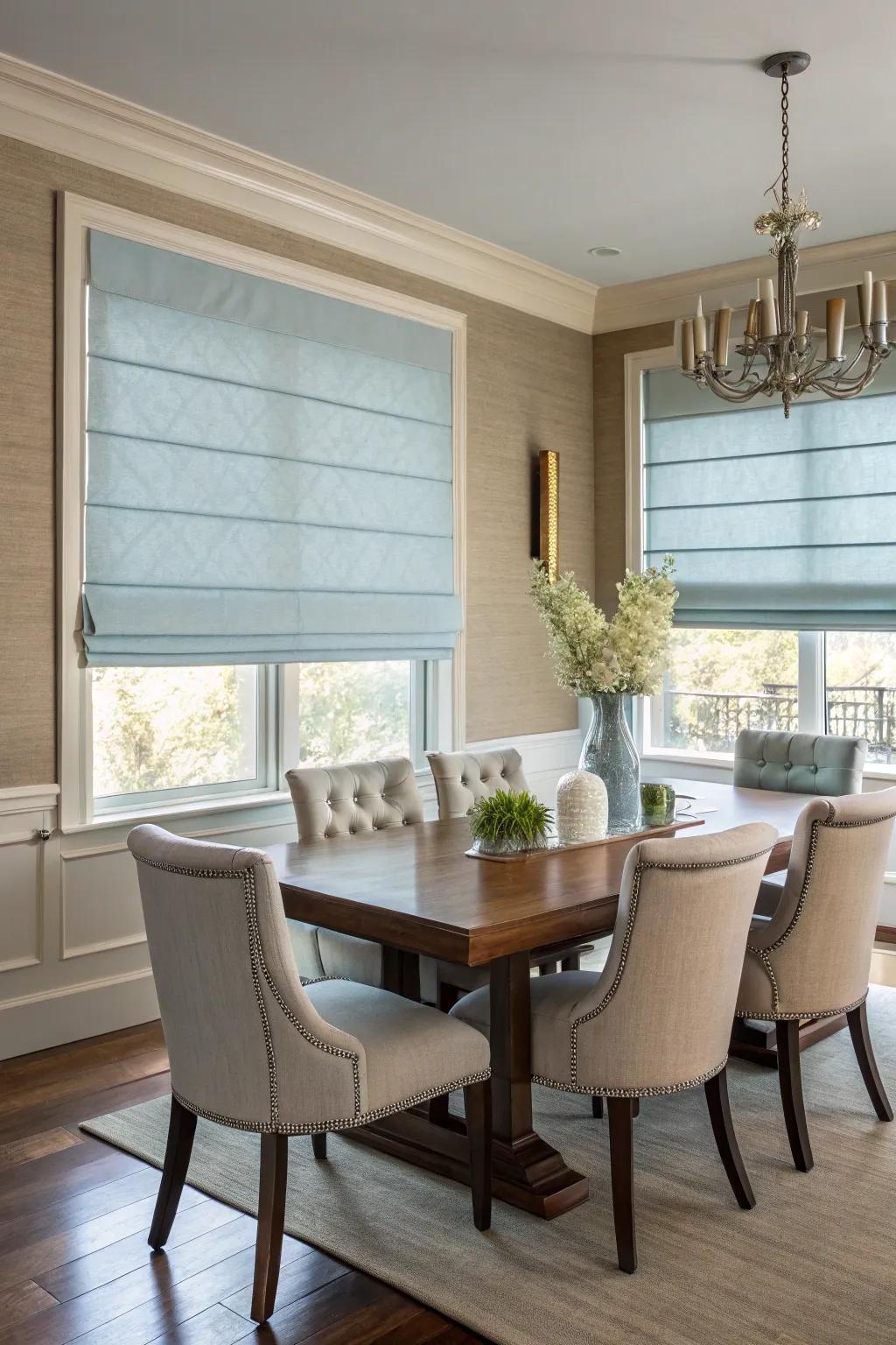 Folding shades in a gentle blue color, providing a sleek and modern look to the dining area.