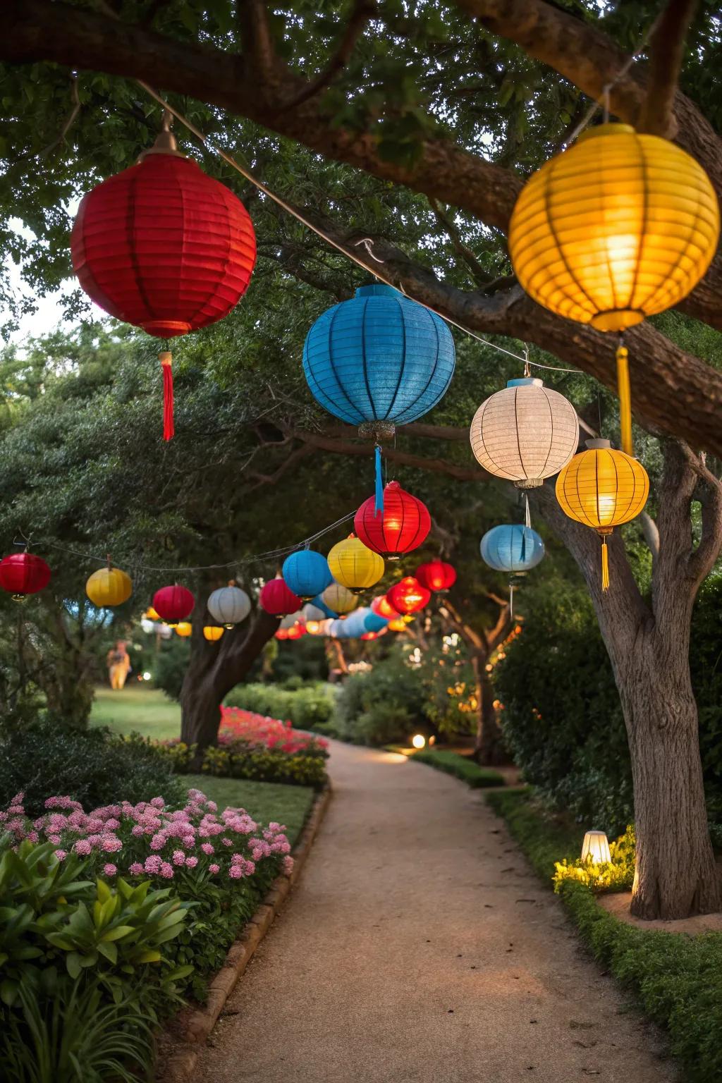 Colorful lanterns suspend from trees, enhancing the party with vibrant charm.