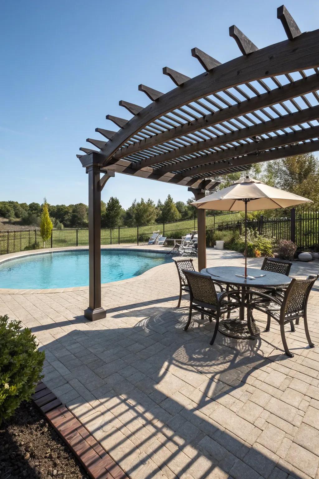 An arbor delivers a shaded retreat on the pool deck.
