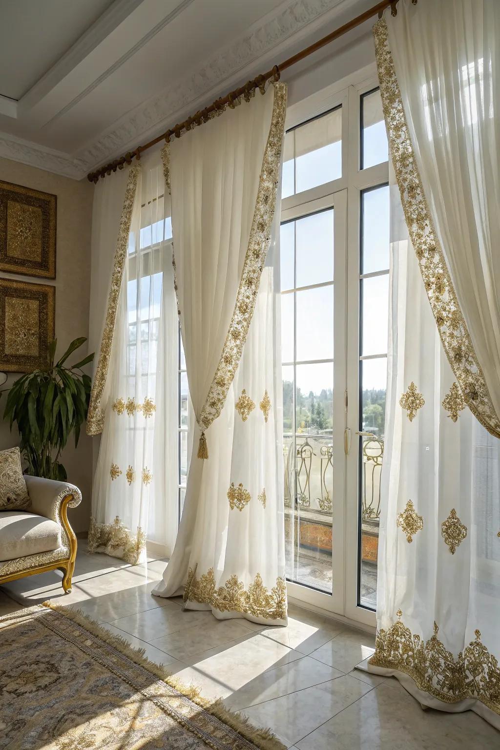 White drapes with gold embroidery frame windows with refinement.