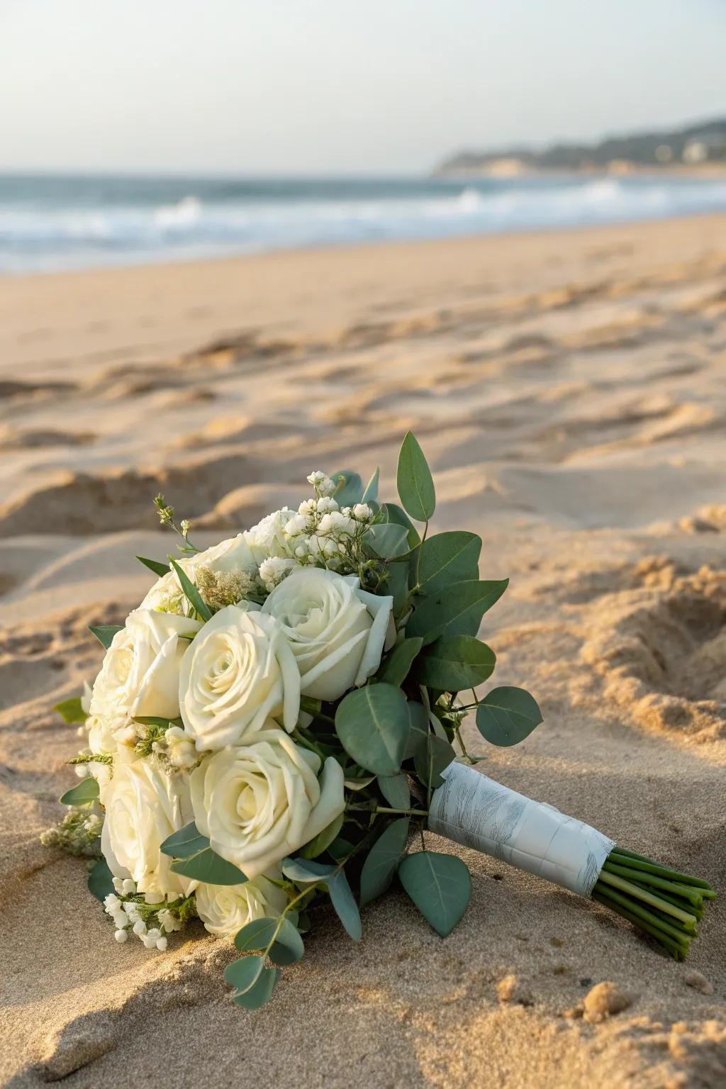An understated white bouquet for a conventional beach wedding.