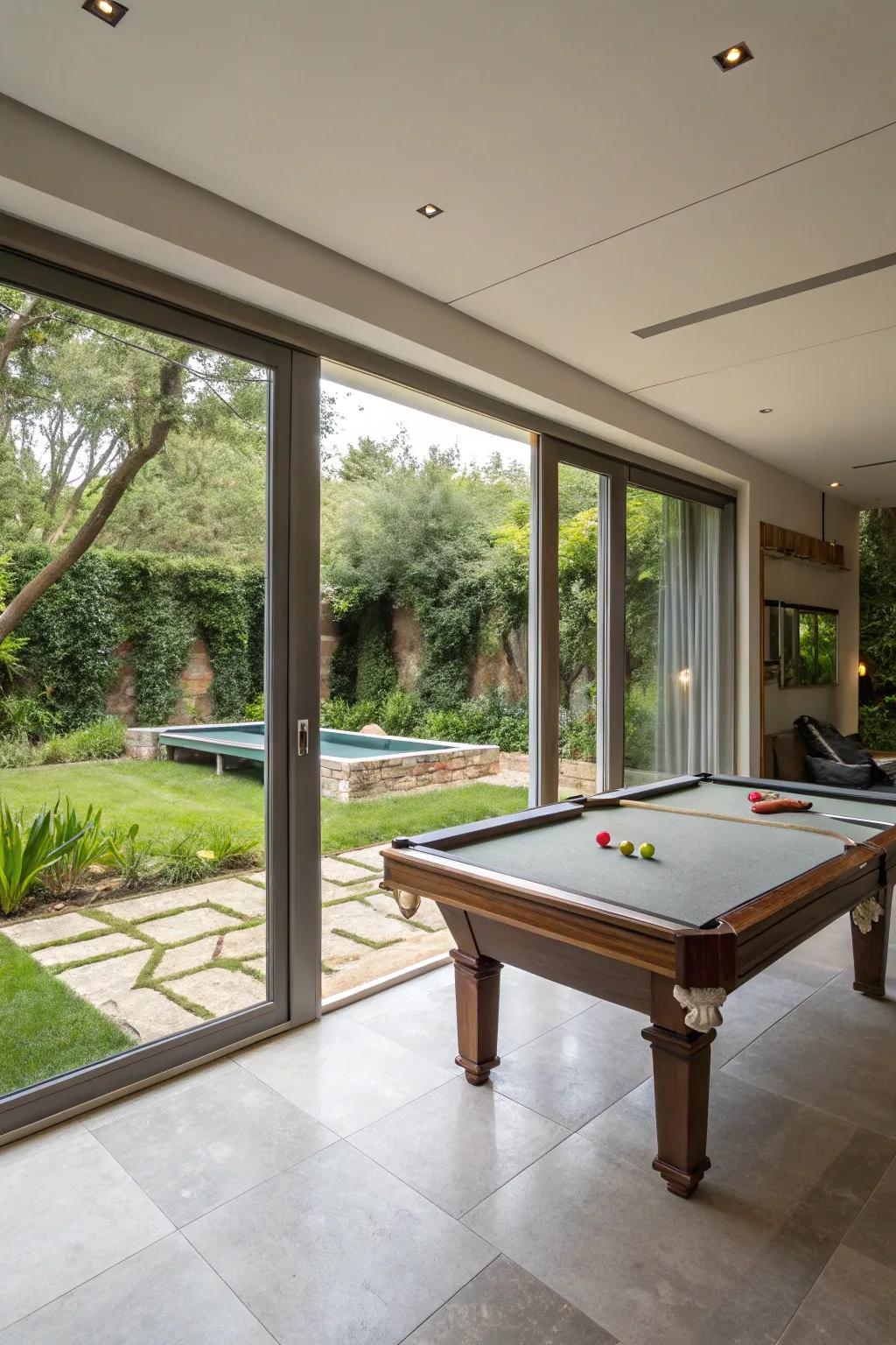 An indoor-outdoor living expanse, complete with a billiard table and access to the garden.