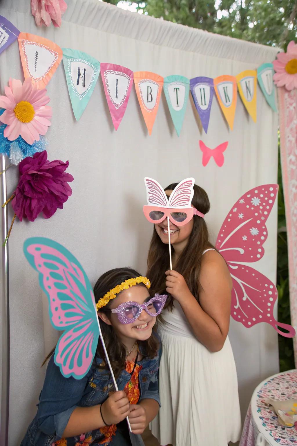 An entertaining photo booth with butterfly-themed props for creating memories.