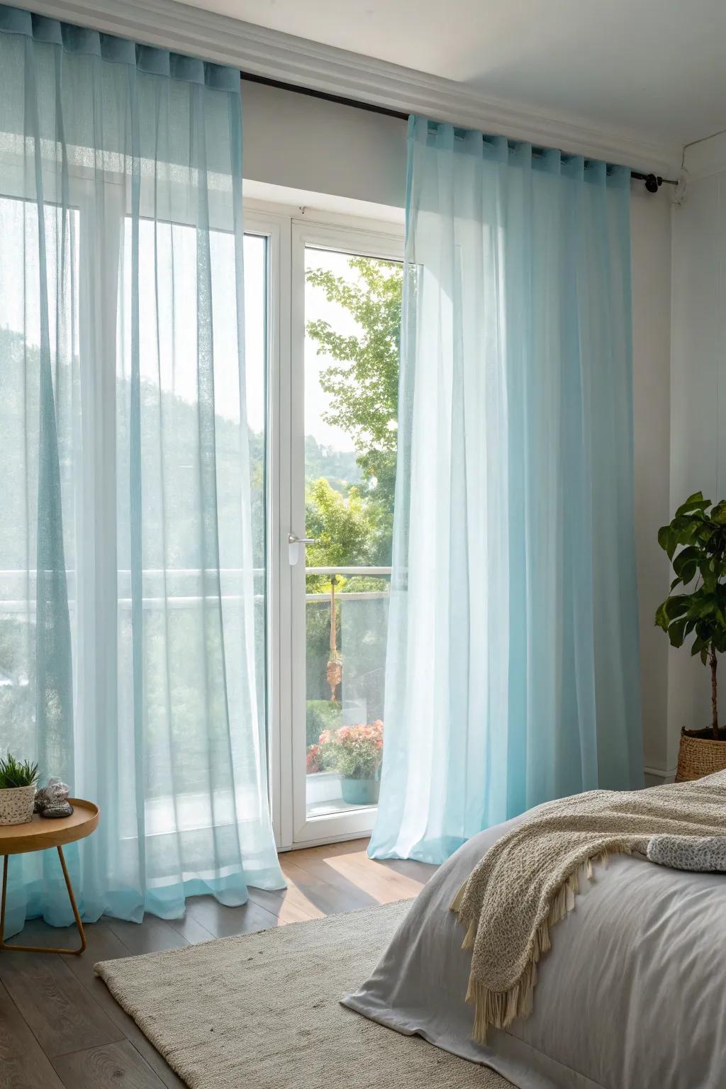 Pale blue window treatments enhance the airiness and brightness of this bedroom.