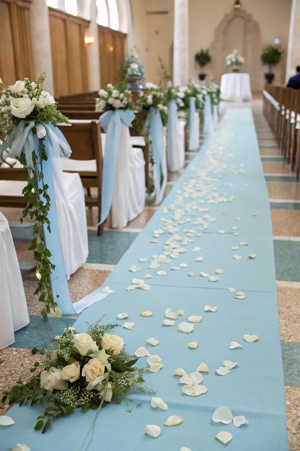 A soft blue aisle runner establishes a romantic pathway for the ceremony.