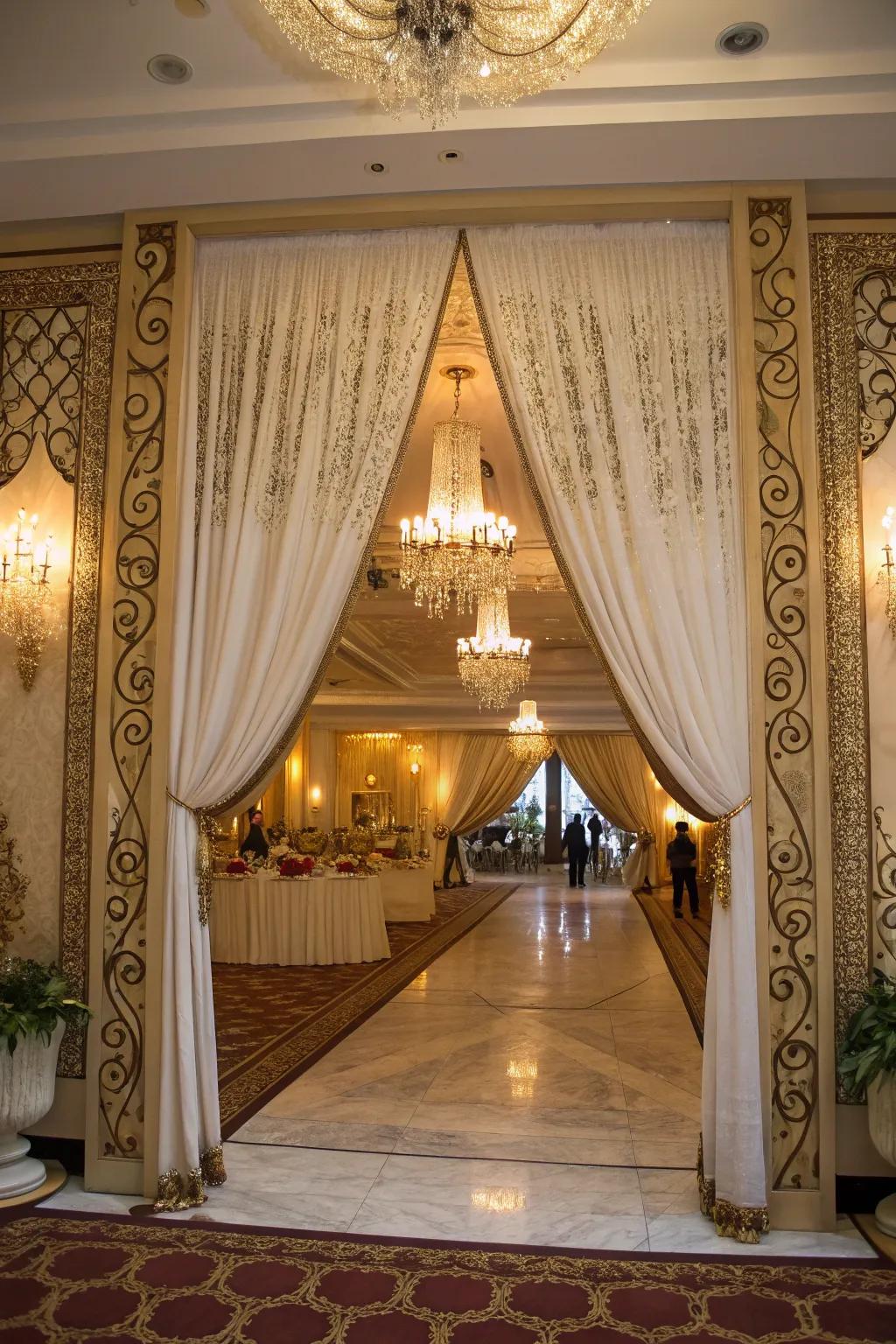 Flowing textiles fashion a grand doorway, establishing an elegant tone for the bridal shower.