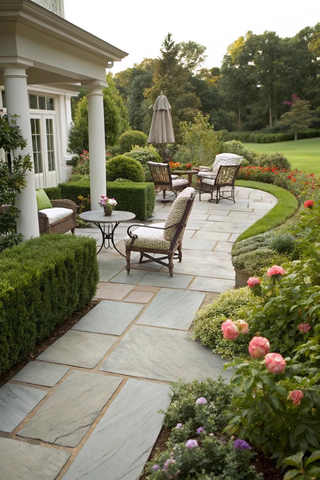 A slate path seamlessly connecting to a cozy outdoor living area.