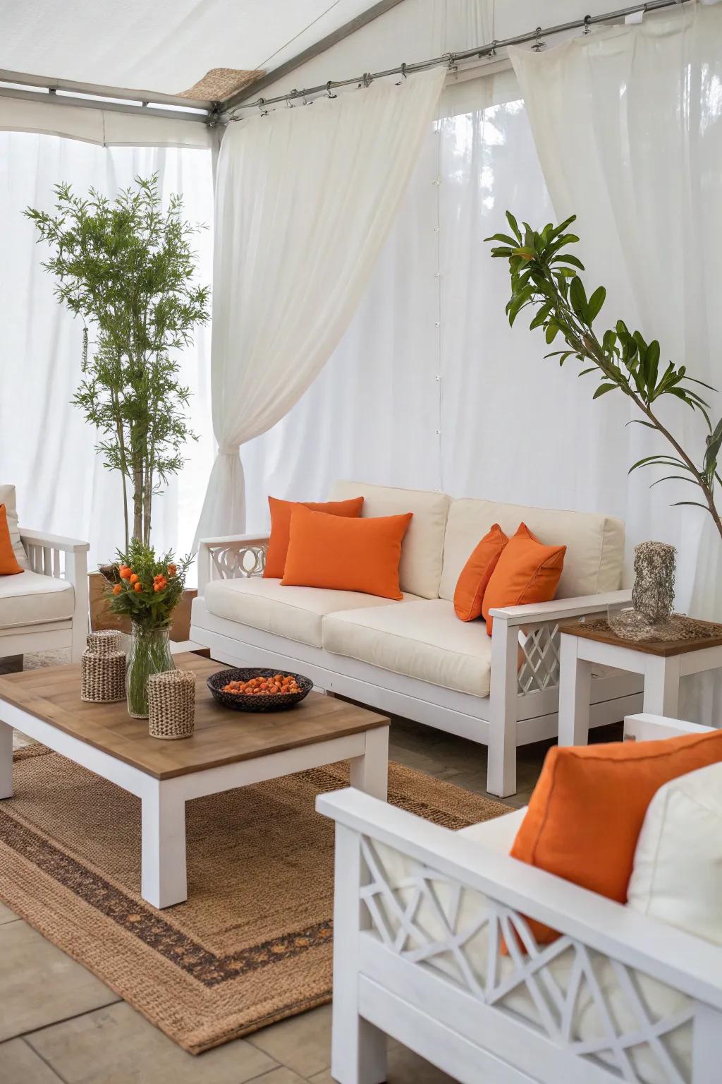 White furniture paired with orange cushions for a chic and timeless look.