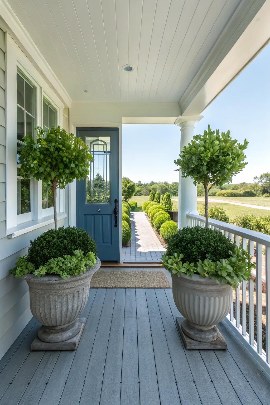 A side porch with balanced plant pots framing a centered doorway.